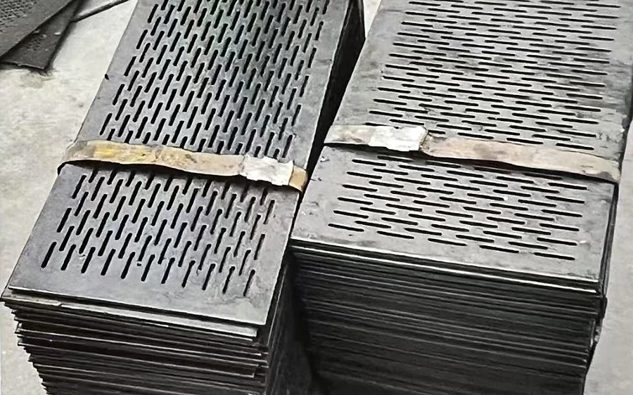 Stacked perforated steel plates with slotted apertures