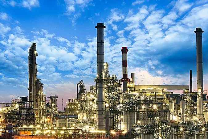 Industrial complex lit up at dusk